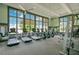 Spacious gym with state-of-the-art equipment and large windows providing ample natural light at 8872 Bismarck Palm Dr, Winter Garden, FL 34787