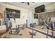 Home gym featuring exercise equipment, a large mirror, and motivational artwork at 8872 Bismarck Palm Dr, Winter Garden, FL 34787