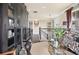 Bright hallway leading to the upper level with dark wood floors and stylish furnishings at 8872 Bismarck Palm Dr, Winter Garden, FL 34787