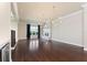 Open-concept living room boasts hardwood floors, fireplace, modern lighting, and ample natural light at 8872 Bismarck Palm Dr, Winter Garden, FL 34787