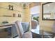 Living room featuring glass shelving, a dining area, and ample natural light at 8872 Bismarck Palm Dr, Winter Garden, FL 34787