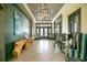 View of a stylish lobby area with a light-green accent wall, seating and light fixtures at 8872 Bismarck Palm Dr, Winter Garden, FL 34787