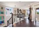 Beautiful second floor landing featuring hardwood floors, decorative lighting, and elegant decor at 8872 Bismarck Palm Dr, Winter Garden, FL 34787