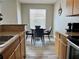 Inviting dining area adjacent to the kitchen with modern table and chairs at 11562 Westwood Blvd # 934, Orlando, FL 32821