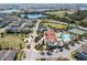 Scenic aerial shot displays a well-planned community with lakes, a clubhouse, tennis courts, and residential neighborhoods at 14645 Scott Key Dr, Winter Garden, FL 34787