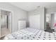 Well-lit bedroom features a view of the ensuite bathroom and closet space at 14645 Scott Key Dr, Winter Garden, FL 34787