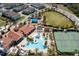 An aerial view of community amenities featuring a pool, tennis courts, a playground, and beautifully landscaped surroundings at 14645 Scott Key Dr, Winter Garden, FL 34787