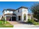 Elegant two-story home with a two-car garage, covered entry, and well-maintained landscaping at 14645 Scott Key Dr, Winter Garden, FL 34787