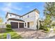 Charming two-story home featuring a brick driveway, well-manicured lawn, and a two-car garage at 14645 Scott Key Dr, Winter Garden, FL 34787