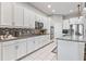 Kitchen featuring granite counters, stainless appliances, and white cabinetry at 14645 Scott Key Dr, Winter Garden, FL 34787