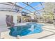 Inviting swimming pool with slide and screened lanai, perfect for outdoor enjoyment and relaxation at 14645 Scott Key Dr, Winter Garden, FL 34787