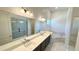 Well-lit bathroom offers dual sinks, a soaking tub, and a tiled shower at 16161 Barkly Ridge Ct, Winter Garden, FL 34787