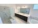 This modern bathroom features a double vanity, soaking tub, and glass shower at 16161 Barkly Ridge Ct, Winter Garden, FL 34787