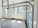 Attached garage with natural light and freshly painted walls at 16161 Barkly Ridge Ct, Winter Garden, FL 34787