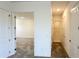 Hallway with carpet flooring and white doors leading to rooms with closets at 16161 Barkly Ridge Ct, Winter Garden, FL 34787