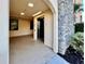 An elevator next to a stone wall that adds a touch of elegance to the building at 16300 County Road 455 # 513, Montverde, FL 34756