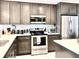 Modern kitchen featuring stainless steel appliances, white backsplash, quartz countertops, and custom cabinetry at 16300 County Road 455 # 513, Montverde, FL 34756