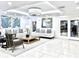 Contemporary-designed lobby with white sofas, decorative pillows, and modern accents at 16300 County Road 455 # 513, Montverde, FL 34756