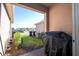 View of the backyard patio with a grill and view of the neighboring community at 17101 Water Spring Blvd, Winter Garden, FL 34787