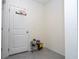 View of hallway with tile flooring, coat rack, and a fun basketball hoop over the door at 17101 Water Spring Blvd, Winter Garden, FL 34787