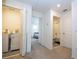 Hallway view showing the laundry room, bedroom, and bathroom on the second floor at 17101 Water Spring Blvd, Winter Garden, FL 34787