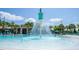 Community pool with a fountain feature and shallow areas, offering fun for all ages at 17101 Water Spring Blvd, Winter Garden, FL 34787