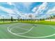 Outdoor basketball court surrounded by lush green spaces and scenic views at 1720 Sawyer Palm Pl, Kissimmee, FL 34747