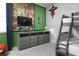 themed bedroom featuring bunkbeds, TV, themed decor and custom wall art at 1720 Sawyer Palm Pl, Kissimmee, FL 34747