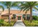 Exterior of fitness center with a welcoming entrance, surrounded by landscaping and palm trees at 1720 Sawyer Palm Pl, Kissimmee, FL 34747