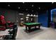 Spacious game room featuring a pool table, arcade games, unique lighting, and a cool blue color palette at 1720 Sawyer Palm Pl, Kissimmee, FL 34747