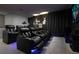 Home theater featuring comfortable seating, cinematic lighting, and a large screen at 1720 Sawyer Palm Pl, Kissimmee, FL 34747