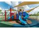 Colorful playground featuring slides, climbing structures, and a soft surface, perfect for hours of outdoor fun at 1720 Sawyer Palm Pl, Kissimmee, FL 34747