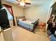 A cozy bedroom with a comfortable bed, a window with curtains, and ample closet space at 1886 Saint Andrews Pl # 1886, Longwood, FL 32779