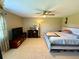 Cozy bedroom featuring a ceiling fan and neutral tones, and comfortable furnishings at 1886 Saint Andrews Pl # 1886, Longwood, FL 32779