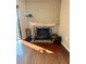 Close up of fireplace with black metal and stone detailing along with hardwood floors at 1886 Saint Andrews Pl # 1886, Longwood, FL 32779