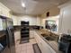 Updated kitchen with stainless steel appliances, granite countertops, and white cabinets at 1886 Saint Andrews Pl # 1886, Longwood, FL 32779