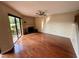 Open living room featuring hardwood floors, fireplace, and sliding glass doors to the back patio at 1886 Saint Andrews Pl # 1886, Longwood, FL 32779