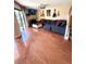 Cozy living room featuring hardwood floors, a fireplace, and staircase to the second floor at 1886 Saint Andrews Pl # 1886, Longwood, FL 32779