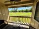 Relaxing patio area with a view of a lush green lawn, perfect for outdoor seating at 1886 Saint Andrews Pl # 1886, Longwood, FL 32779
