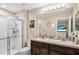 Bathroom featuring double sinks, shower, and large mirror at 2087 Crystal Bell St, Orlando, FL 32824