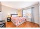 Bedroom featuring a double bed with nightstands on each side and a television on the wall at 217 Sevilla Ave, Davenport, FL 33897