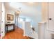 Hallway leading to a staircase and a table with decor at 217 Sevilla Ave, Davenport, FL 33897