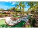 Fun mini golf course winding through lush landscaping for Gathering-friendly entertainment and outdoor recreation at 217 Sevilla Ave, Davenport, FL 33897