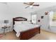 This spacious bedroom features tile flooring, a ceiling fan, and neutral walls at 2285 Canyon Breeze Ave, Kissimmee, FL 34746