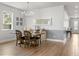 Elegant dining area with modern chandelier, wood table and stylish decor at 2413 Park Ridge St, Apopka, FL 32712