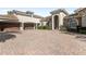 Expansive brick driveway leading to a grand home with a porte-cochere and three-car garage at 25603 High Hampton Cir, Sorrento, FL 32776