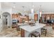 Expansive kitchen featuring large islands, custom cabinetry, modern appliances, and ample counter space at 25603 High Hampton Cir, Sorrento, FL 32776