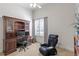 Home office with built-in shelving, desk and comfortable massage chair at 25603 High Hampton Cir, Sorrento, FL 32776