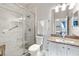 Modern bathroom features a marble shower and granite countertops at 302 Calabria Ave, Davenport, FL 33897