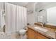 Cozy bathroom with granite countertop vanity and shower featuring a curtain at 302 Calabria Ave, Davenport, FL 33897